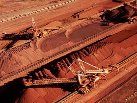 Iron ore is stockpiled for export at Port Hedland in Western Australia. BHP Billiton is on the cusp of destroying 86 Aboriginal sites in the central Pilbara to expand its South Flank iron ore mining operation. Photograph: Bhp Billiton/AFP/Getty Images