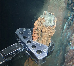 a grabber breaks off a section of hydrothermal vent. Photograph: Nautilus minerals a grabber breaks off a section of hydrothermal vent. Photograph: Nautilus minerals