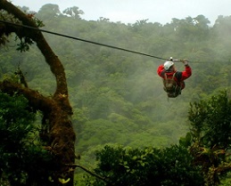 visitor zip-lines above the tree canopy in Costa Rica’s Monteverde National Park; the country is among those where ecotourism initiatives have been adversely impacted by the pandemic. (iStock)