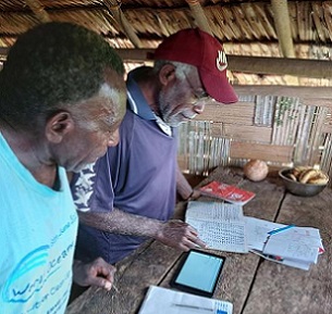 Image: Christopher Bartlett, Resilience Noel Kaibaba and Philip Vanuau of Bamboo Bay, Malekula entering turtle nest data into Kobo Toolbox, an online smart-phone data collection App, as part of the By-catch and Integrated Ecosystem Management (BIEM) Initiative in Vanuatu. Image: Christopher Bartlett, Resilience