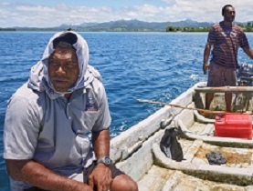 Mosese and Kinikoto collect sea-urchins from the Navakavu Reef, off Fiji’s main island, Viti Levu. The tabu, a traditional marker of fishing grounds, prevents over-fishing. Photograph: Kurt Johnson & Thomas Dallow