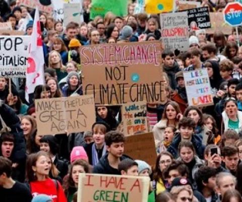 Climate protesters in Lausanne, Switzerland, days before the start of the Davos summit. Photograph: Stefan Wermuth/AFP via Getty Images