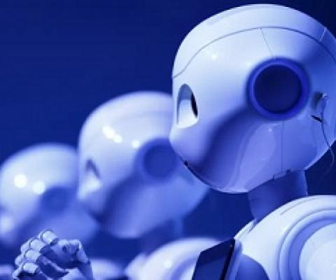  A row of Pepper robots developed by SoftBank Group Corp. The humanoid robots can be programmed to do many things – often replacing or augmenting human jobs. Photograph: Bloomberg via Getty Images