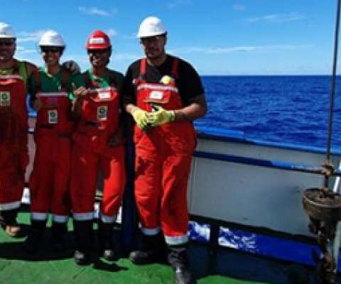 The multi-agency Cook Islands government team at sea aboard a research vessel. Eusenio Fatialofa (CIIC), Rima Browne (SBMA), Chloe Wragg (MMR) Junior Tapoki (NES). 19100490
