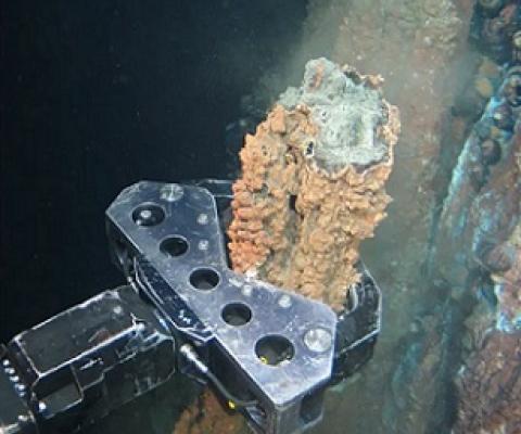a grabber breaks off a section of hydrothermal vent. Photograph: Nautilus minerals