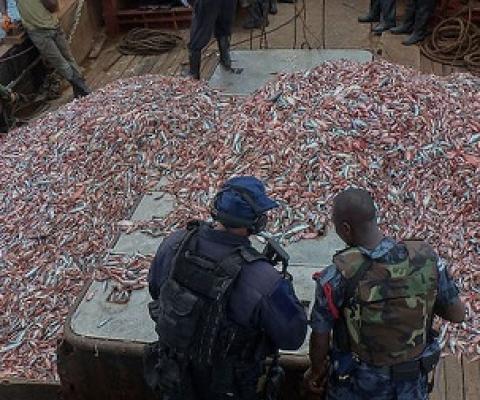 U.S. Coast Guard officials and a Ghanaian Navy sailor inspect a fishing vessel suspected of illegal fishing. Image courtesy of the U.S. Navy/Kwabena Akuamoah-Boateng.