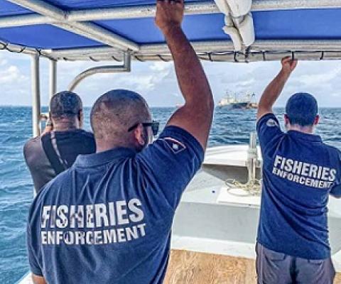 Marshall Islands fisheries officers Beau Bigler and Melvin Silk head across Majuro Lagoon in February 2020 to board and inspect an arriving vessel. Credit - Francisco Blaha.