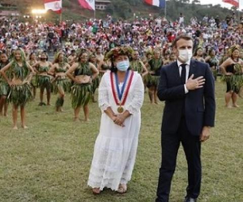 France's President Emmanuel Macron (R) and Hiva Oa Mayor Joëlle Frebault (in white) attend a welcoming ceremony during his visit to Atuona on Hiva Oa, the second largest island of the Marquesas Islands, French Polynesia on July 25, 2021. Photo: Ludovic MARIN / AFP