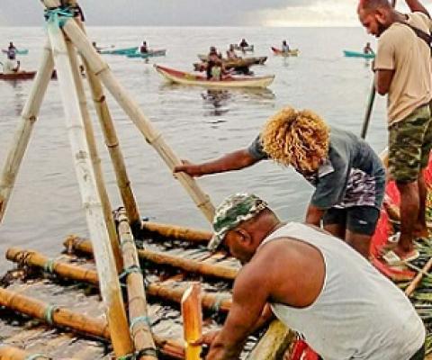Malaita Provincial Ward Member Preston Billy (front) works with local fishers to prepare the local FAD for its first harvest on 14 December 2020. Credit - Victor Suraniu.