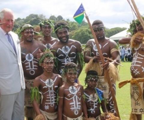 Prince Charles takes a photo with Pele Dancers of Temotu province at Lawson Tama. Photo: Carlos Aruafu