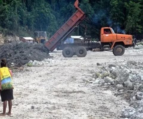 A woman at the Ruarata log pond in East Are'Are. credit - Jan van der Ploeg