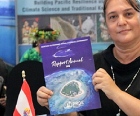 SPREP Meeting delegate holding SPREP 2018 annual report