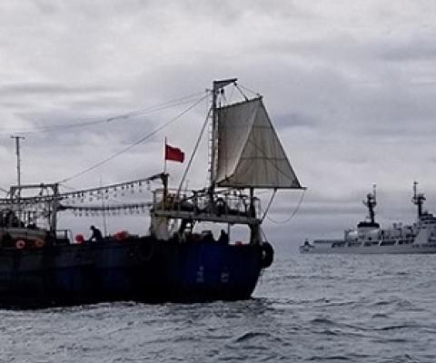 The crew of the Coast Guard Cutter Douglas Munro conducts a boarding of a Chinese fishing vessel. Credit - USCG