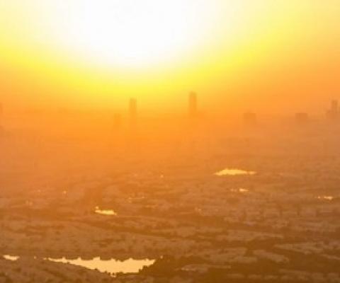 sun sets over a city. source - SHUTTERSTOCK.COM